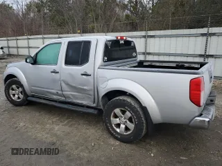2010 Nissan Frontier SE with VIN 1N6AD0EV2AC405609, listed as a Copart auction lot 87615465 with 170,555 mi miles and Salvage title. Bid and sale history available at DreamBid. Image 2.