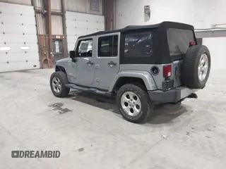 2014 Jeep Wrangler Unlimited Sahara with VIN 1C4BJWEG5EL164350, listed as a IAAI auction lot 42018586 with 113,222 mi miles. Bid and sale history available at carsss.com. Image 3.