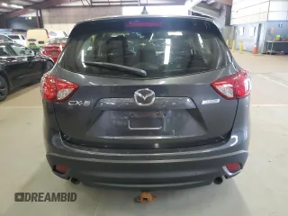 2015 Mazda CX-5 Sport z VIN JM3KE2BE6F0473738, wystawiony jako Copart lot #58718185 z przebiegiem 90 862 mil mil oraz Czysty tytuł • Clean title. Historia ofert i sprzedaży dostępna na DreamBid. Obrazek 6.