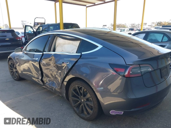 2018 Tesla Model 3 Long Range Battery with VIN 5YJ3E1EA7JF163401, listed as a IAAI auction lot 41829681 with 90,065 mi miles. Bid and sale history available at carsss.com. Image 13.