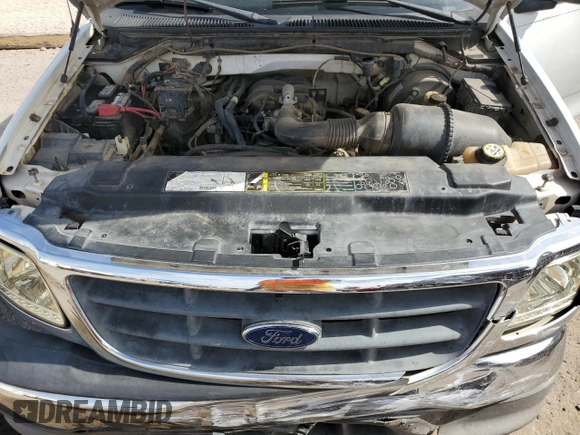 2003 Ford F-150 XL z VIN 1FTRX17233NB92067, wystawiony jako Copart lot #57986555 z przebiegiem 179 101 mil mil oraz Szkoda całkowita • Salvage title. Historia ofert i sprzedaży dostępna na DreamBid. Obrazek 11.
