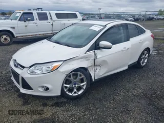 2014 Ford Focus Titanium with VIN 1FADP3J27EL142095, listed as a IAAI auction lot 42004419 with 139,515 mi miles. Bid and sale history available at carsss.com. Image 17.