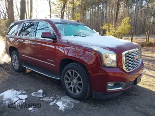 2019 GMC Yukon Denali with VIN 1GKS2CKJ8KR137636, listed as a IAAI auction lot 41264171 with 153,136 mi miles. Bid and sale history available at carsss.com. Image 1.