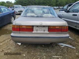 1991 Honda Accord z VIN 1HGCB7655MA125418, wystawiony jako Copart lot #42049712 z przebiegiem 241 937 mil mil oraz Nie do naprawy • Non repairable. Historia ofert i sprzedaży dostępna na DreamBid. Obrazek 6.