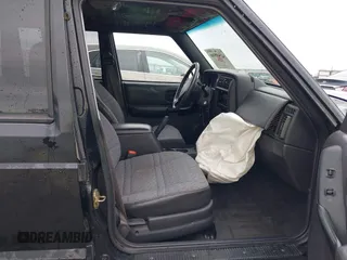 1999 Jeep Cherokee Sport with VIN 1J4FT68S6XL598558, listed as a IAAI auction lot 41549504 with 238,004 mi miles. Bid and sale history available at carsss.com. Image 5.