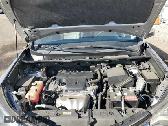 2018 Toyota RAV4 XLE with VIN JTMWFREV1JJ205906, listed as a Copart auction lot 84700564 with 64,953 mi miles and Salvage Title. Bid and sale history available at DreamBid. Image 12.