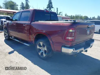 2019 Ram 1500 Laramie with VIN 1C6SRFJT2KN677400, listed as a IAAI auction lot 42441010 with 76,750 mi miles and . Bid and sale history available at DreamBid. Image 3.