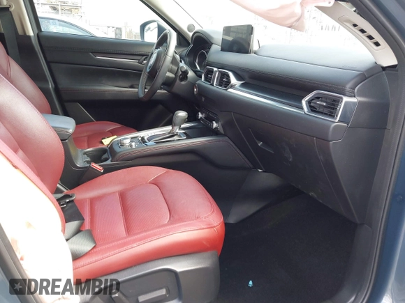 2023 Mazda CX-5 S Carbon Edition z VIN JM3KFBCM5P0179543, wystawiony jako IAAI lot #41950082 z przebiegiem 31 573 mil mil oraz . Historia ofert i sprzedaży dostępna na DreamBid. Obrazek 5.
