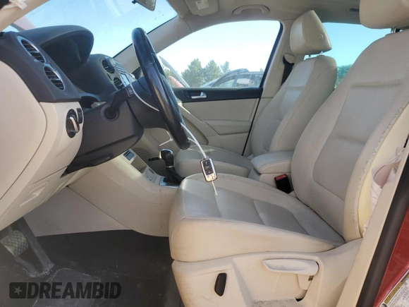 2014 Volkswagen Tiguan SE with VIN WVGAV3AX9EW038118, listed as a Copart auction lot 56329625 with 134,620 mi miles and Salvage title. Bid and sale history available at DreamBid. Image 7.