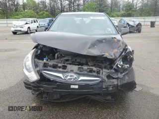 2014 Hyundai Accent GLS z VIN KMHCT4AE6EU705838, wystawiony jako Copart lot #58581515 z przebiegiem 40 265 mil mil oraz Szkoda całkowita • Salvage title. Historia ofert i sprzedaży dostępna na DreamBid. Obrazek 5.