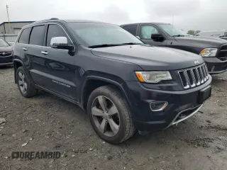 2015 Jeep Grand Cherokee Overland with VIN 1C4RJFCT2FC762573, listed as a Copart auction lot 59123275 with 229,128 mi miles and Salvage title. Bid and sale history available at DreamBid. Image 4.