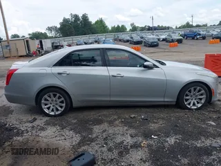 2014 Cadillac CTS Luxury RWD z VIN 1G6AR5S38E0173628, wystawiony jako IAAI lot #42343647 z przebiegiem 166 035 mil mil oraz . Historia ofert i sprzedaży dostępna na DreamBid. Obrazek 13.