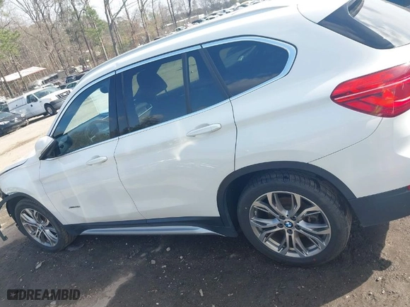 2017 BMW X1 xDrive28i with VIN WBXHT3Z30H4A64932, listed as a IAAI auction lot 41779359 with 72,612 mi miles. Bid and sale history available at carsss.com. Image 15.