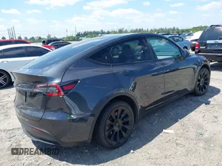 2024 Tesla Model Y with VIN 7SAYGDED3RF019063, listed as a IAAI auction lot 42061888 with 13,763 mi miles and . Bid and sale history available at DreamBid. Image 4.
