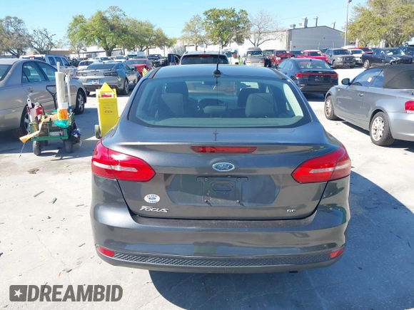 2018 Ford Focus SE z VIN 1FADP3F27JL245603, wystawiony jako IAAI lot #41773395 z przebiegiem 94 044 mil mil oraz . Historia ofert i sprzedaży dostępna na DreamBid. Obrazek 16.