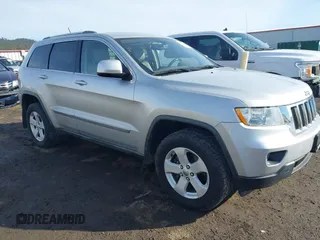 2011 Jeep Grand Cherokee 70th Anniversary with VIN 1J4RR4GTXBC718994, listed as a IAAI auction lot 41688158 with 121,680 mi miles. Bid and sale history available at carsss.com. Image 1.