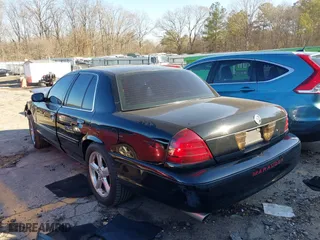 2003 Mercury Marauder with VIN 2MEHM75V33X640454, listed as a IAAI auction lot 41341810 with 173,660 mi miles. Bid and sale history available at carsss.com. Image 3.