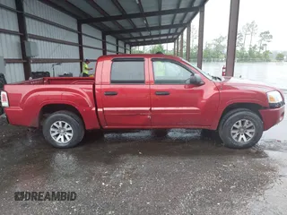 2008 Mitsubishi Raider LS z VIN 1Z7HC28K48S619894, wystawiony jako IAAI lot #42400123 z przebiegiem 246 929 mil mil oraz . Historia ofert i sprzedaży dostępna na DreamBid. Obrazek 13.