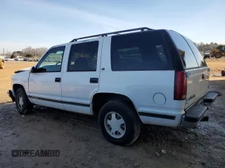 1999 GMC Yukon with VIN 1GKEC13R0XJ811710, listed as a Copart auction lot 43014995 with 311,948 mi miles and Salvage Title. Bid and sale history available at carsss.com. Image 2.