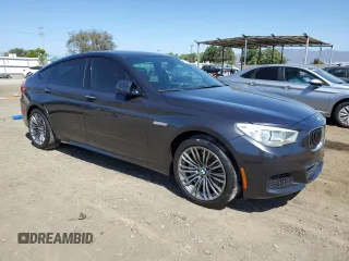 2014 BMW 5 Series GT 535i with VIN WBA5M2C55ED871907, listed as a Copart auction lot 73001564 with 90,576 mi miles and Salvage Title. Bid and sale history available at carsss.com. Image 4.
