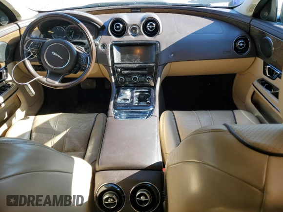 2015 Jaguar XJ with VIN SAJWA2GT8FMV83276, listed as a Copart auction lot 86521754 with 105,010 mi miles and Salvage Title. Bid and sale history available at DreamBid. Image 8.