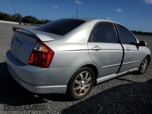 2006 Kia Spectra EX with VIN KNAFE121365229594, listed as a Copart auction lot 77311084 with 129,789 mi miles and Salvage Title. Bid and sale history available at carsss.com. Image 3.