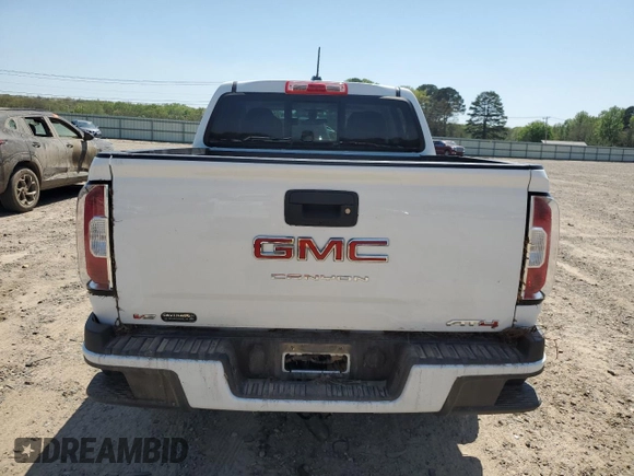 2021 GMC Canyon 4WD AT4 z VIN 1GTG6FEN5M1118081, wystawiony jako Copart lot #52452785 z przebiegiem 92 960 mil mil oraz Szkody całkowita. Historia ofert i sprzedaży dostępna na DreamBid. Obrazek 6.