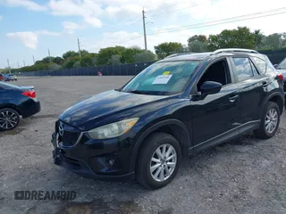 2014 Mazda CX-5 Touring with VIN JM3KE2CYXE0384987, listed as a IAAI auction lot 42052196 with 151,765 mi miles. Bid and sale history available at carsss.com. Image 2.