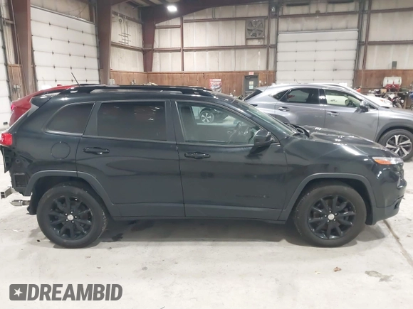 2014 Jeep Cherokee Latitude with VIN 1C4PJMCS6EW299532, listed as a IAAI auction lot 41833888 with 199,915 mi miles and . Bid and sale history available at DreamBid. Image 13.