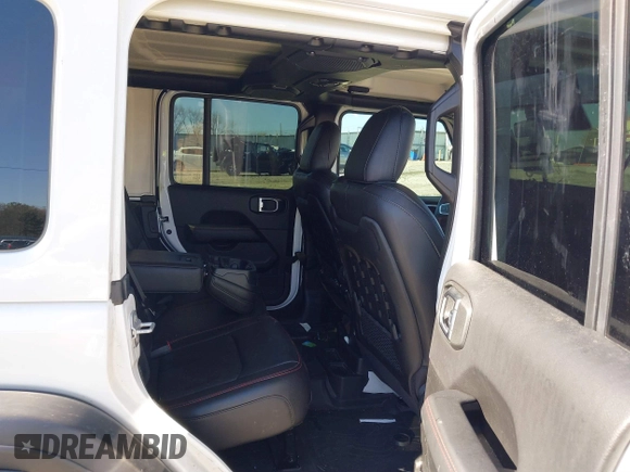 2022 Jeep Wrangler Unlimited Rubicon z VIN 1C4JJXFGXNW121489, wystawiony jako IAAI lot #41749550 z przebiegiem 56 601 mil mil oraz . Historia ofert i sprzedaży dostępna na DreamBid. Obrazek 8.
