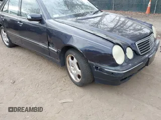 2002 Mercedes-Benz E-Class AWD with VIN WDBJF83J32X068355, listed as a IAAI auction lot 41872613 with 143,501 mi miles. Bid and sale history available at carsss.com. Image 6.