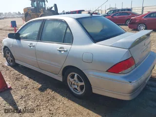 2003 Mitsubishi Lancer OZ-Rally with VIN JA3AJ86E23U069464, listed as a IAAI auction lot 41775000 with 148,735 mi miles. Bid and sale history available at carsss.com. Image 3.