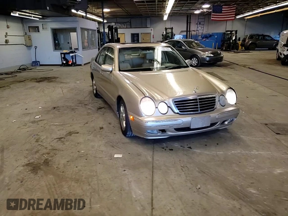 2002 Mercedes-Benz E-Class with VIN WDBJF65J12B485293, listed as a Copart auction lot 77561984 with 140,708 mi miles and Salvage Title. Bid and sale history available at carsss.com. Image 10.