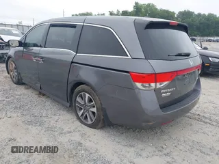 2014 Honda Odyssey Touring with VIN 5FNRL5H98EB008953, listed as a IAAI auction lot 42291179 with Not provided miles and . Bid and sale history available at DreamBid. Image 3.