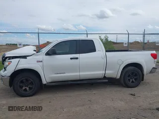 2012 Toyota Tundra with VIN 5TFUW5F16CX225421, listed as a IAAI auction lot 42210783 with 207,025 mi miles and . Bid and sale history available at DreamBid. Image 14.