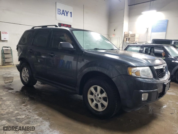 2010 Mazda Tribute Touring with VIN 4F2CY9C70AKM07812, listed as a Copart auction lot 42432055 with 132,562 mi miles and Salvage Title. Bid and sale history available at carsss.com. Image 4.