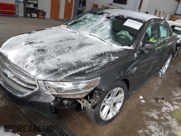 2015 Ford Taurus SEL with VIN 1FAHP2E89FG202589, listed as a IAAI auction lot 41592298 with 105,410 mi miles and . Bid and sale history available at carsss.com. Image 2.