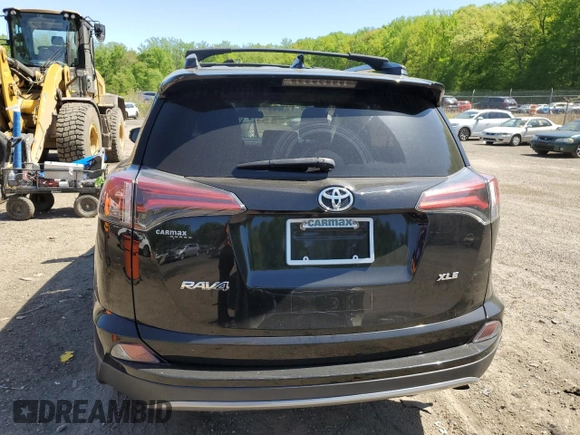 2018 Toyota RAV4 XLE with VIN 2T3WFREVXJW471443, listed as a Copart auction lot 54890655 with 131,677 mi miles and Salvage title. Bid and sale history available at DreamBid. Image 6.