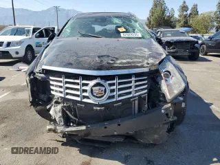 2015 Cadillac SRX Performance Collection с VIN 3GYFNCE38FS607680, выставлен на аукционе Copart как лот 62929235 с пробегом 55 638 миль миль и Списание • Salvage title. История ставок и продаж доступна на DreamBid. Изображение 5.