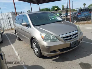2005 Honda Odyssey EX-L with VIN 5FNRL38615B407908, listed as a IAAI auction lot 42076045 with 170,950 mi miles and . Bid and sale history available at DreamBid. Image 1.