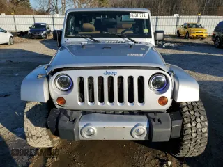 2011 Jeep Wrangler Sahara with VIN 1J4GA5D14BL628876, listed as a Copart auction lot 87317374 with 84,179 mi miles and Salvage Title. Bid and sale history available at DreamBid. Image 5.