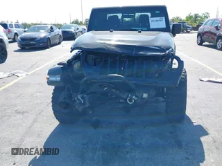 2021 Jeep Gladiator Willys with VIN 1C6HJTAGXML613431, listed as a IAAI auction lot 42180502 with 64,572 mi miles and . Bid and sale history available at DreamBid. Image 5.