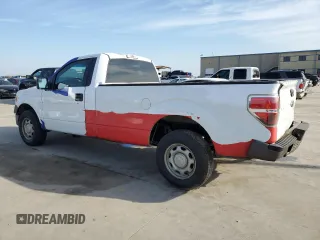 2014 Ford F-150 XL with VIN 1FTMF1CM2EKD70205, listed as a Copart auction lot 43963335 with 214,912 mi miles and Salvage title. Bid and sale history available at DreamBid. Image 2.