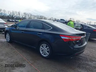 2014 Toyota Avalon Limited with VIN 4T1BK1EB2EU103936, listed as a IAAI auction lot 41703894 with 104,657 mi miles. Bid and sale history available at carsss.com. Image 3.