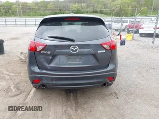 2014 Mazda CX-5 Touring with VIN JM3KE2CYXE0332517, listed as a IAAI auction lot 42109592 with 138,214 mi miles. Bid and sale history available at carsss.com. Image 16.