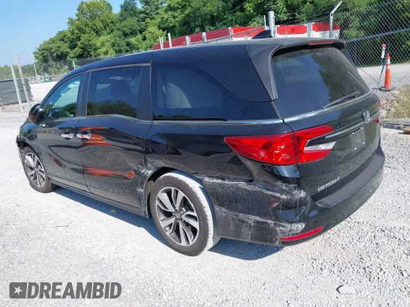 2021 Honda Odyssey Touring with VIN 5FNRL6H84MB027396, listed as a IAAI auction lot 42616650 with 67,207 mi miles and . Bid and sale history available at DreamBid. Image 3.
