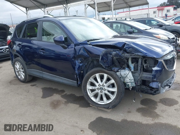 2014 Mazda CX-5 Grand Touring with VIN JM3KE2DY1E0307911, listed as a IAAI auction lot 42064898 with 133,934 mi miles. Bid and sale history available at carsss.com. Image 14.