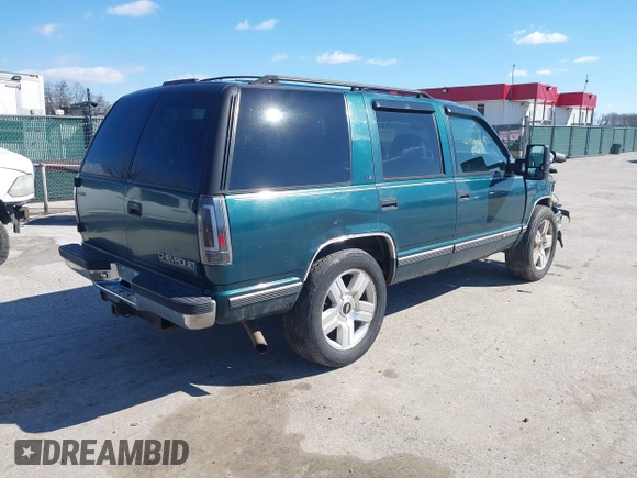 1999 Chevrolet Tahoe Z71 z VIN 1GNEK13R2XJ325602, wystawiony jako IAAI lot #41590107 z przebiegiem 204 611 mil mil oraz . Historia ofert i sprzedaży dostępna na DreamBid. Obrazek 4.