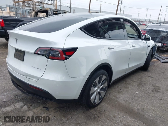 2022 Tesla Model Y Long Range with VIN 7SAYGDEE3NF518061, listed as a IAAI auction lot 41896233 with 34,714 mi miles and . Bid and sale history available at carsss.com. Image 4.