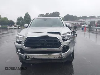 2023 Toyota Tacoma SR with VIN 3TYAX5GN0PT071080, listed as a IAAI auction lot 42426897 with 58,017 mi miles and . Bid and sale history available at DreamBid. Image 12.